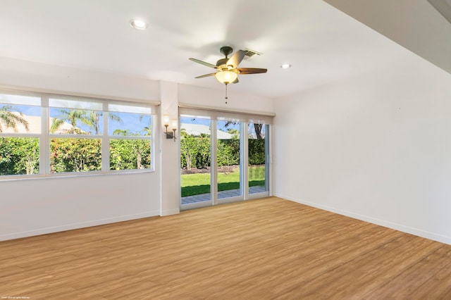 empty room with light hardwood / wood-style flooring and ceiling fan