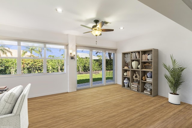 interior space featuring light hardwood / wood-style floors and ceiling fan