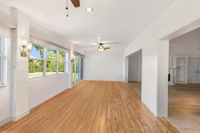 unfurnished room with light hardwood / wood-style floors and ceiling fan