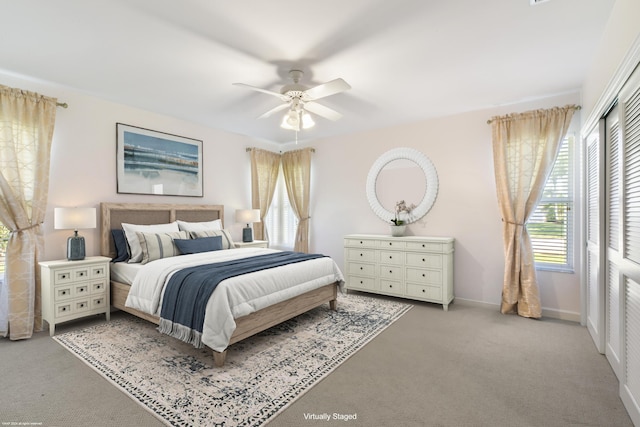 carpeted bedroom with ceiling fan