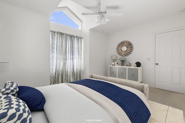 carpeted bedroom with lofted ceiling and ceiling fan