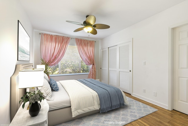 bedroom featuring a closet, hardwood / wood-style floors, and ceiling fan