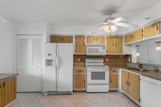 kitchen featuring ceiling fan, light tile floors, sink, white appliances, and backsplash