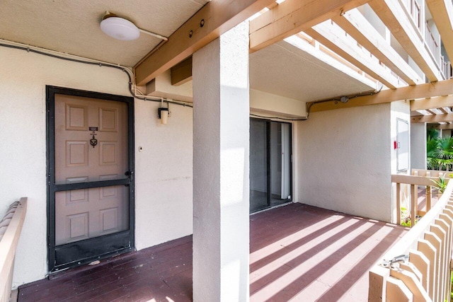 doorway to property with a pergola