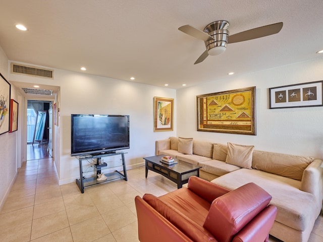 tiled living room with ceiling fan