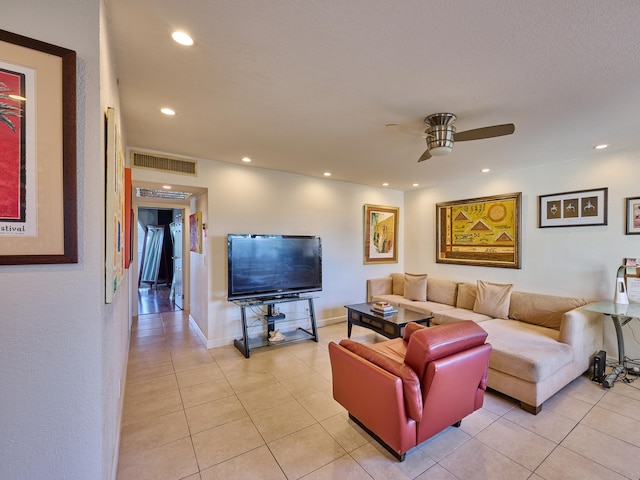 tiled living room featuring ceiling fan