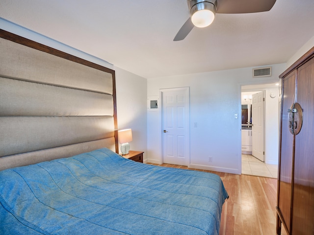 bedroom featuring a closet, ceiling fan, and light hardwood / wood-style floors