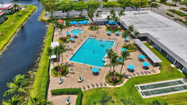 birds eye view of property with a water view