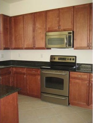 kitchen with light tile flooring and stainless steel appliances