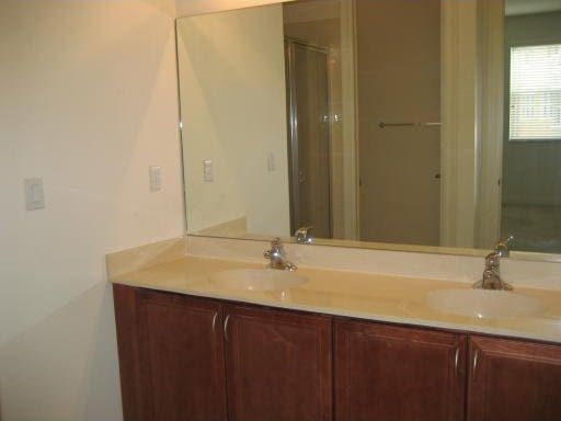 bathroom with dual vanity