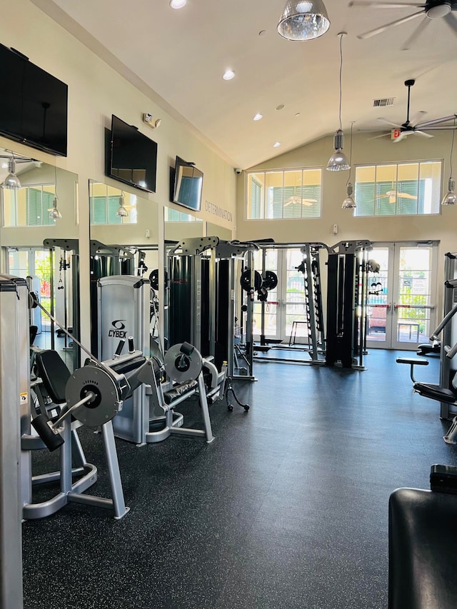 gym with french doors, ceiling fan, and high vaulted ceiling