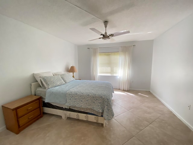 tiled bedroom with ceiling fan