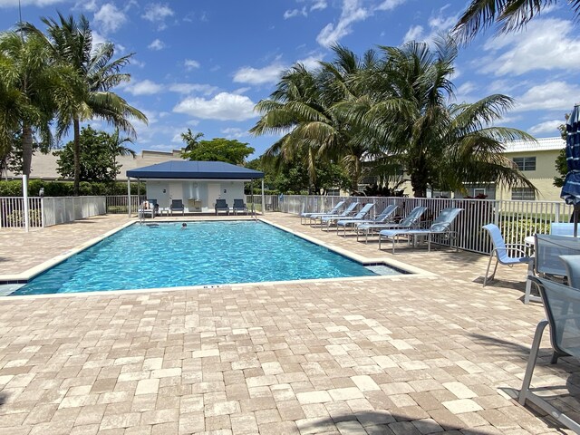 view of swimming pool with a patio area