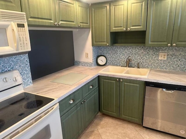 kitchen featuring backsplash, light tile patterned flooring, white appliances, and sink