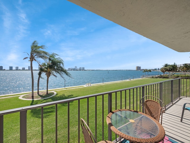 balcony featuring a water view