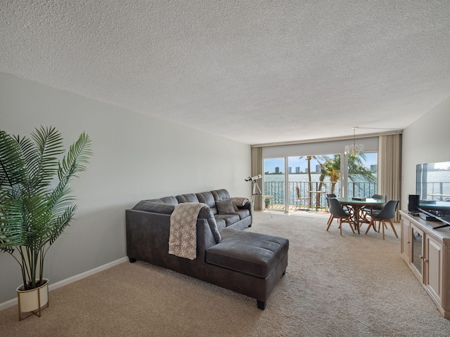 living room featuring carpet flooring and a textured ceiling