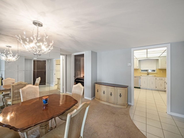 carpeted dining room featuring a notable chandelier and sink