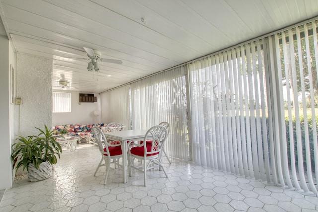 sunroom / solarium with ceiling fan and a wealth of natural light