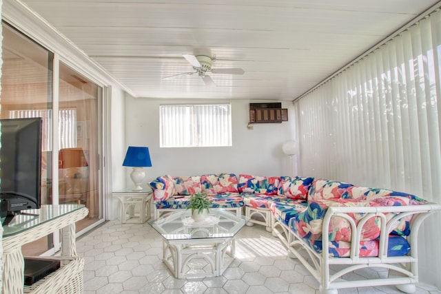 sunroom with ceiling fan and a wall unit AC