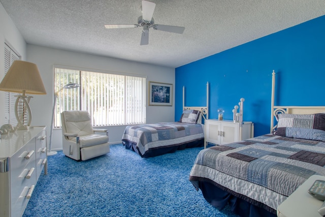 bedroom with carpet flooring, ceiling fan, and a textured ceiling