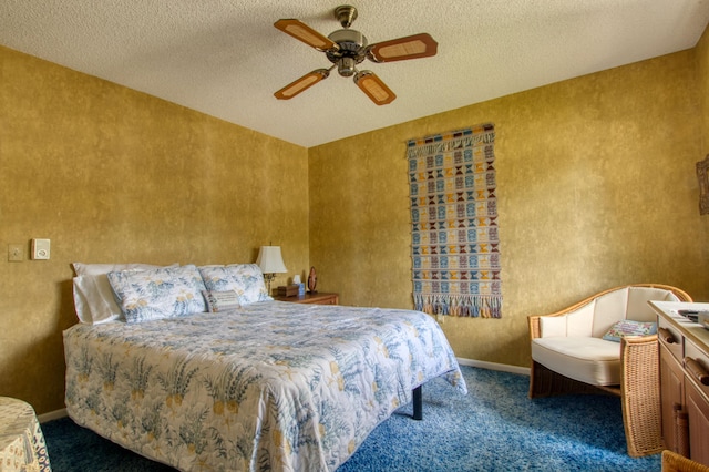 carpeted bedroom featuring a textured ceiling and ceiling fan