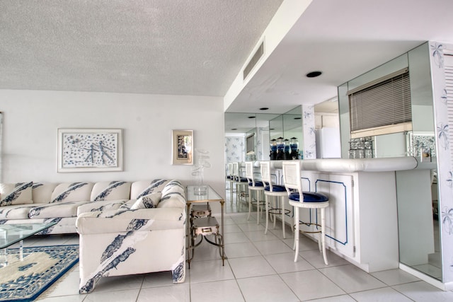 tiled living room with a textured ceiling