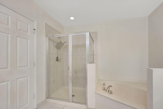 bathroom with tile floors and plus walk in shower