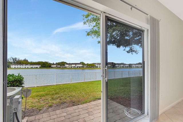 unfurnished sunroom with a water view