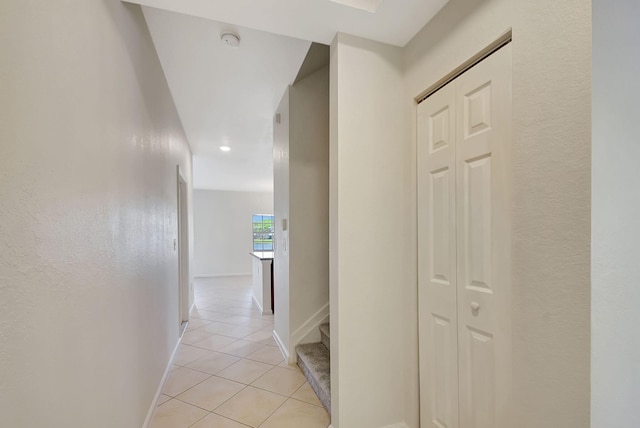 hall with light tile flooring