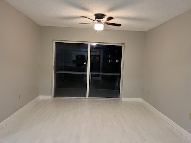 unfurnished room with hardwood / wood-style flooring and ceiling fan