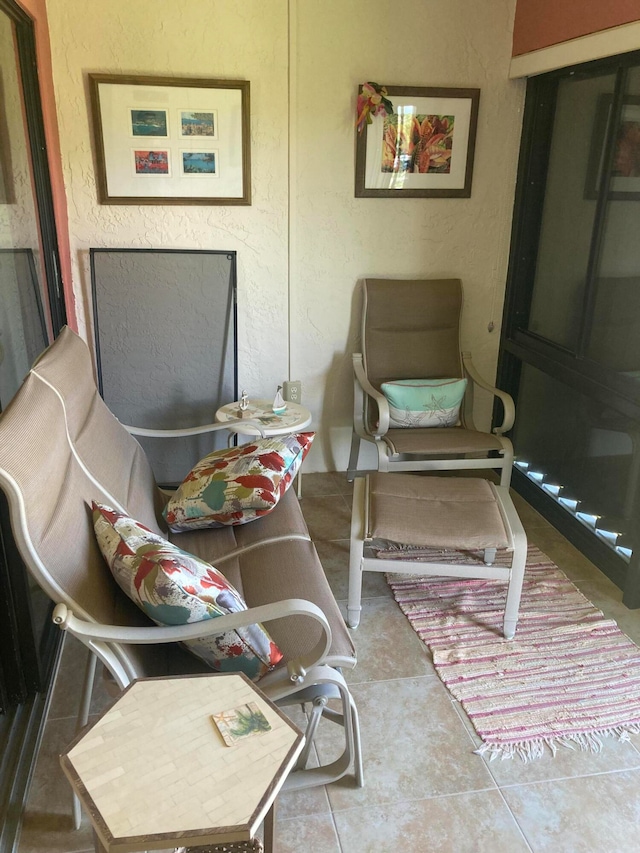 sitting room with tile flooring