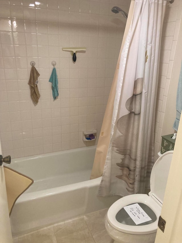 bathroom featuring toilet, shower / bath combination with curtain, and tile floors