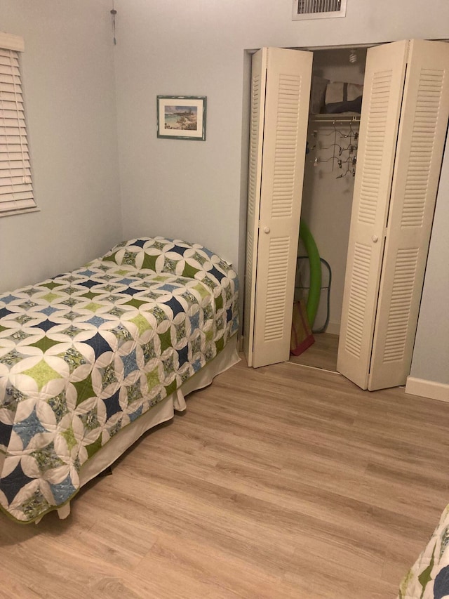 bedroom featuring wood-type flooring