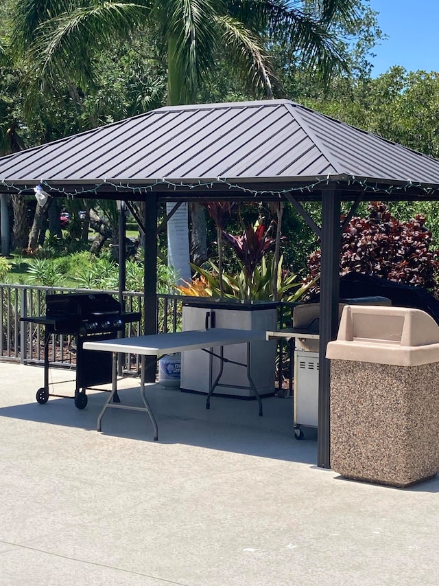 view of property's community featuring a gazebo and a patio