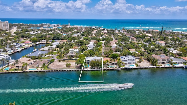 birds eye view of property featuring a water view