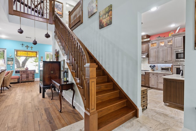 staircase with wood-type flooring