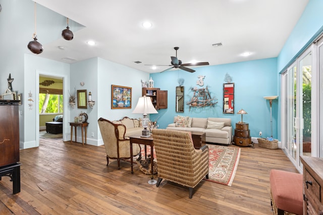 living room featuring hardwood / wood-style floors, plenty of natural light, and ceiling fan