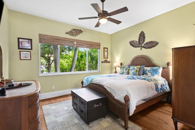 bedroom with ceiling fan and wood-type flooring