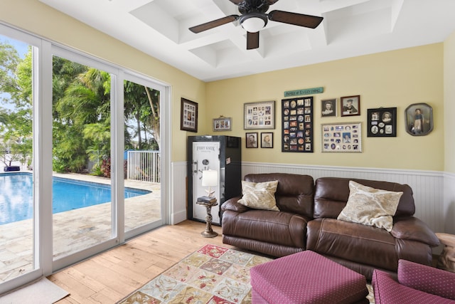 living room with ceiling fan and light wood-type flooring