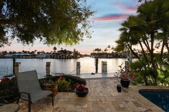 exterior space with a boat dock and a water view