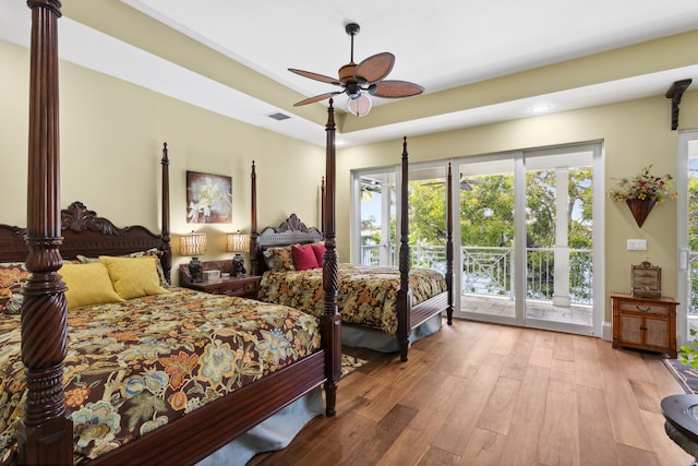 bedroom featuring access to exterior, ceiling fan, and light hardwood / wood-style floors