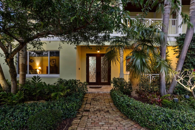 property entrance featuring french doors and a balcony