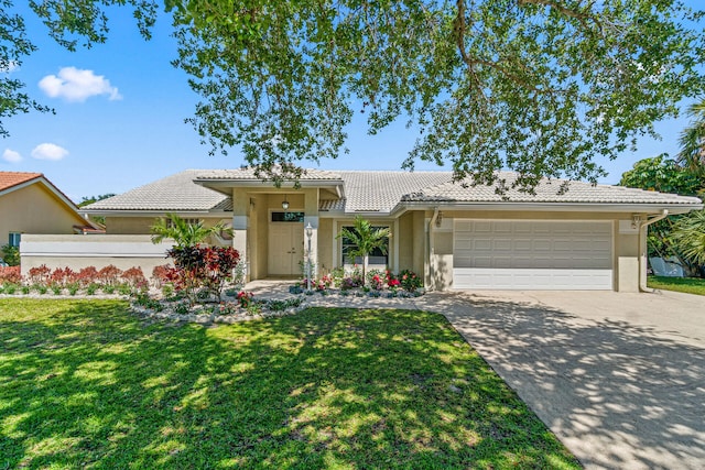 view of front facade featuring a front lawn and a garage