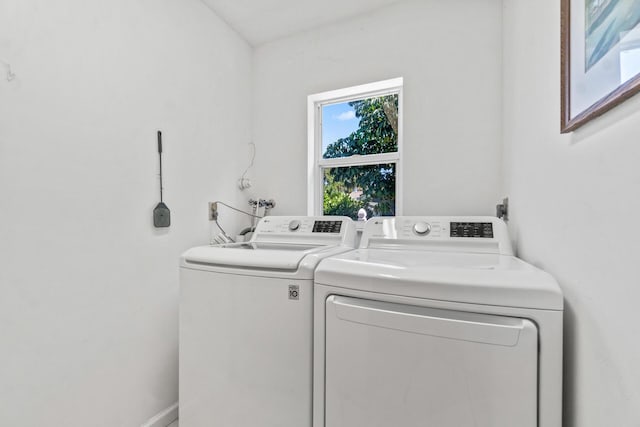 laundry area with separate washer and dryer