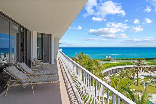 balcony featuring a water view