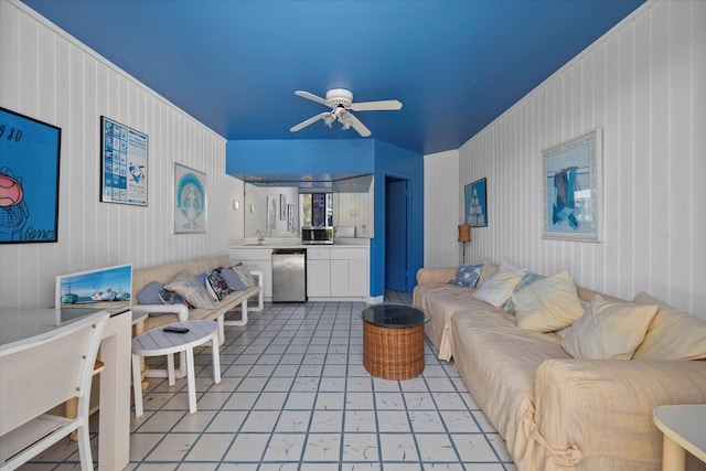 tiled living room featuring ceiling fan