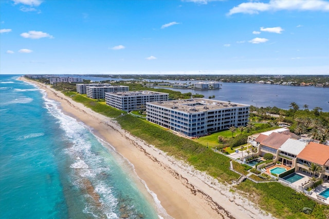 bird's eye view with a water view and a view of the beach