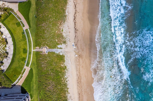 aerial view with a water view and a beach view