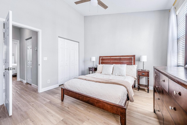 bedroom featuring lofted ceiling, ceiling fan, and light wood-type flooring