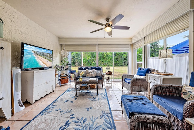 sunroom featuring a wealth of natural light and ceiling fan